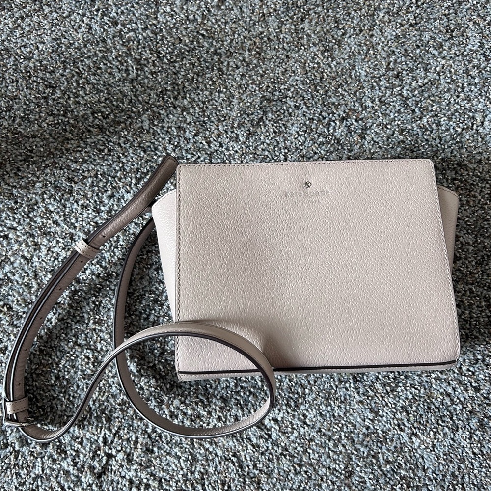Kate Spade Cream Crossbody Bag with Minimalist Design